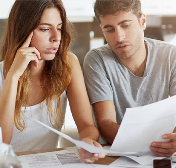 Man and woman looking at paperwork together
