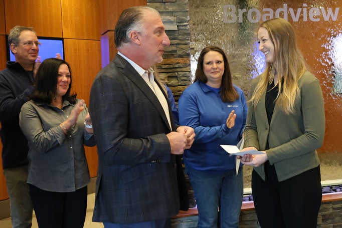 Michael Castellana presenting a check to someone