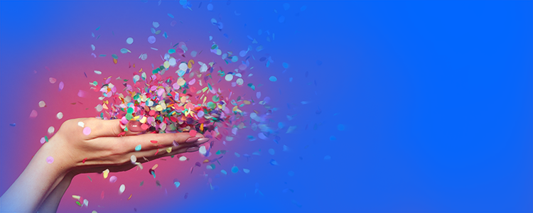 Hands holding a pile of confetti